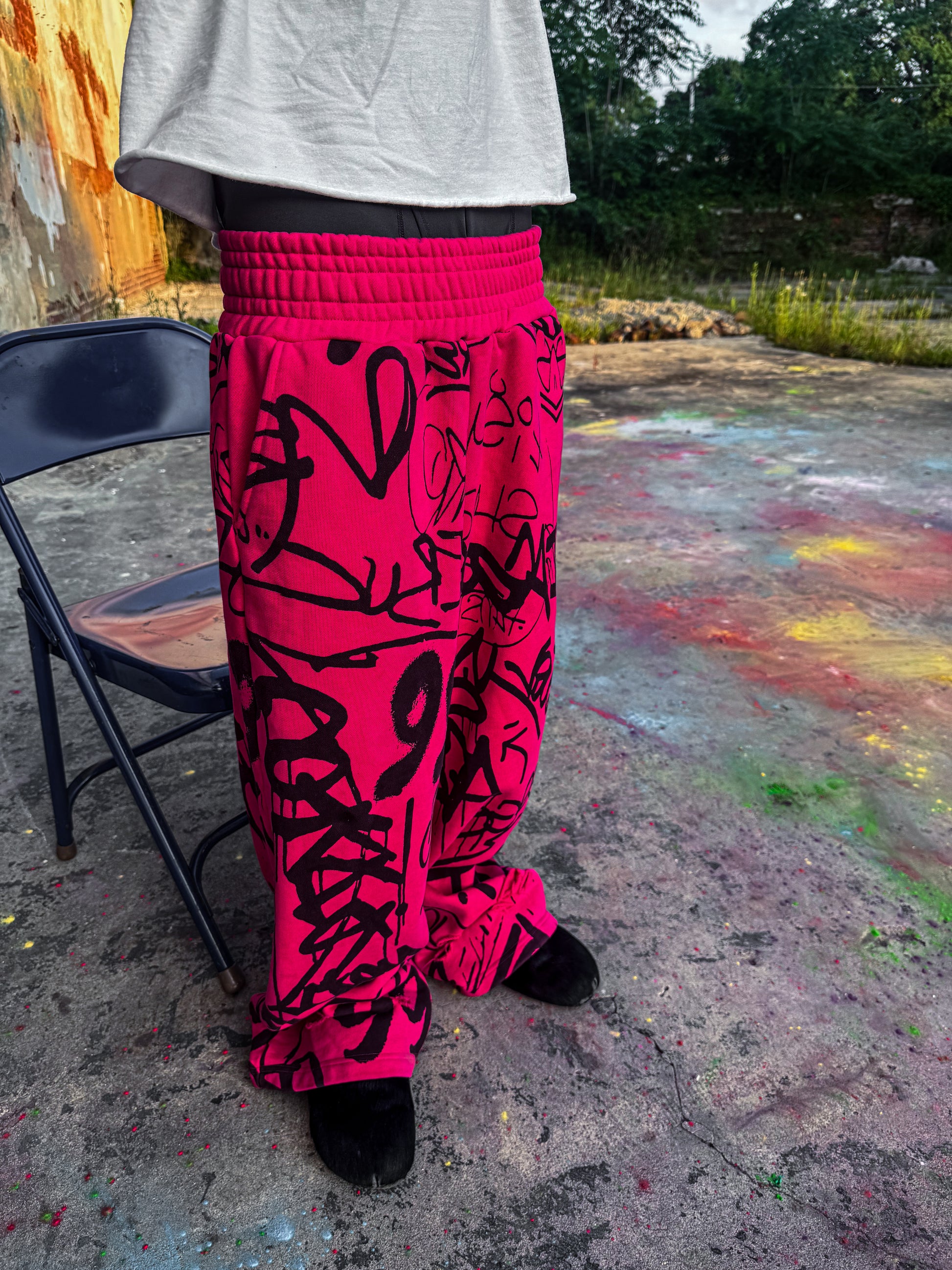 Pink Vandalizm Sweats featuring black graffiti print, ultra-heavyweight French terry cotton, styled with an extra baggy fit.